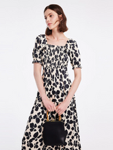 a lady in off shoulder floral print maxi dress